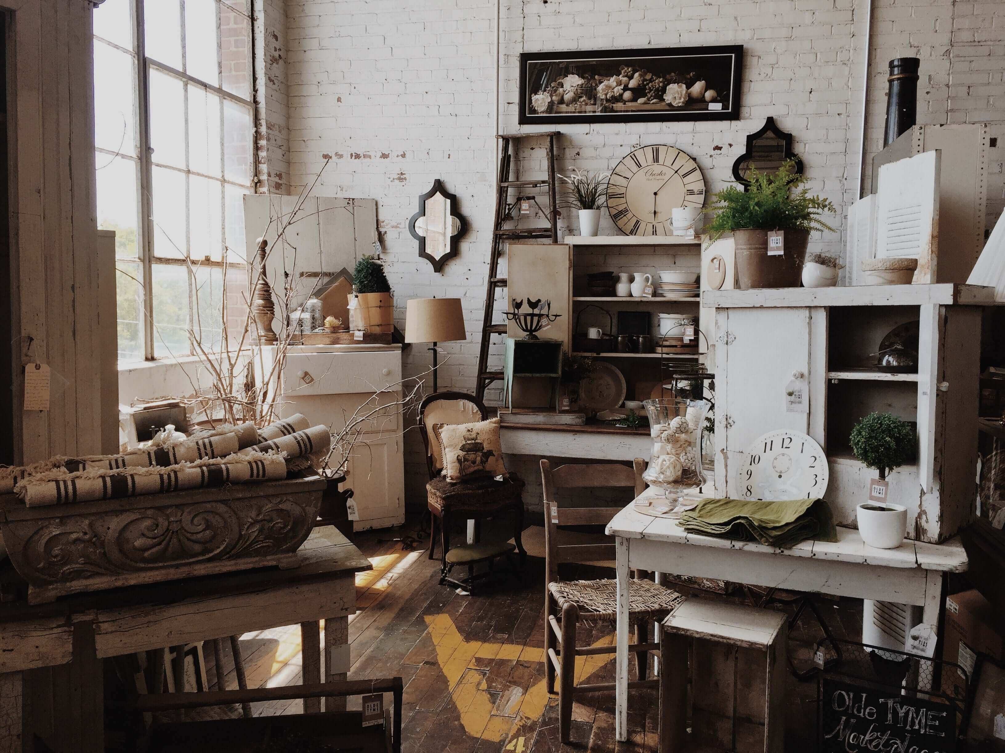 cozy vintage decor setup featuring rustic furniture, natural elements, and charming accessories in a bright space.