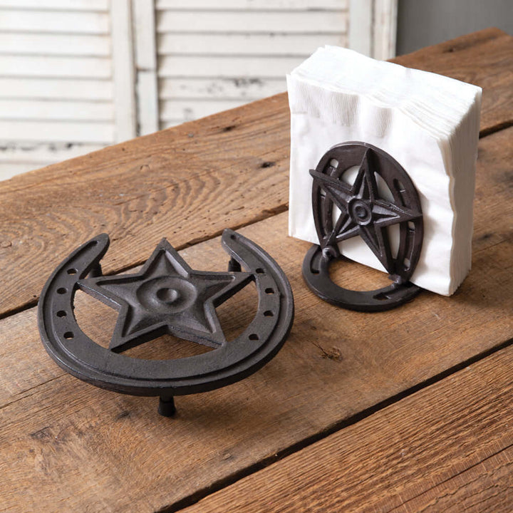 Rustic Western Star Napkin Holder in cast iron with horseshoe design on wooden table. Perfect for farmhouse décor.