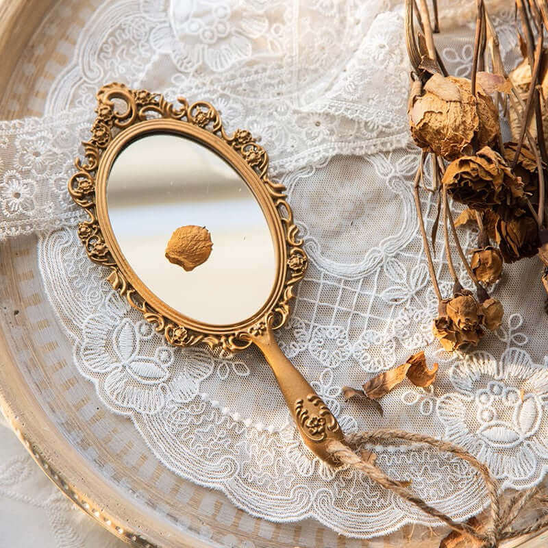 Antique Handheld Mirror with Ornate Gold Frame