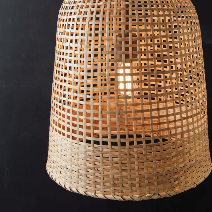 Bohemian handwoven grass pendant lamp showcasing intricate craftsmanship and warm light for a cozy atmosphere.