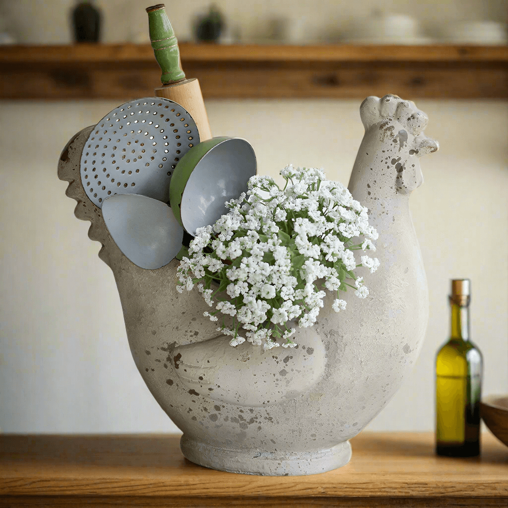 Rustic farmhouse chicken container holding flowers and kitchen utensils, perfect for country-style decor.