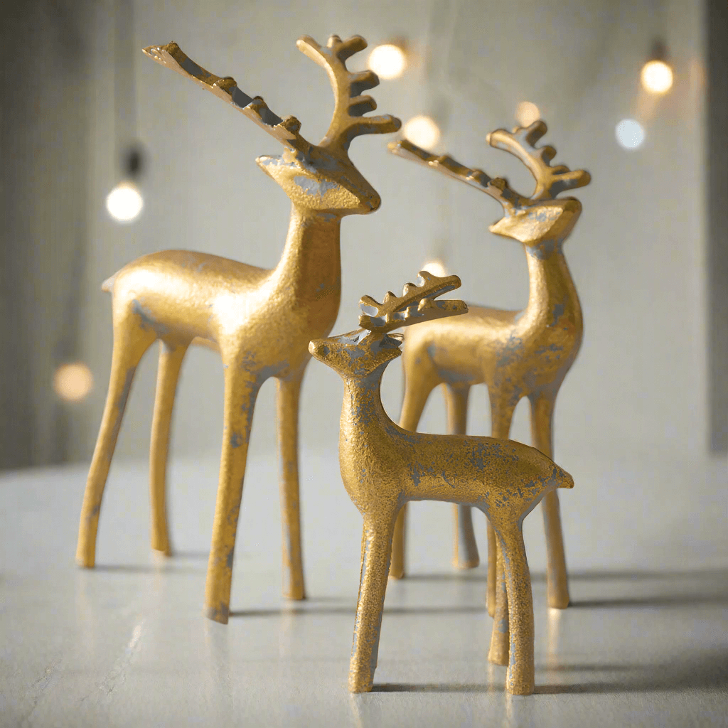 Gold reindeer figurines set of 3, perfect for elegant holiday decorations and festive displays.