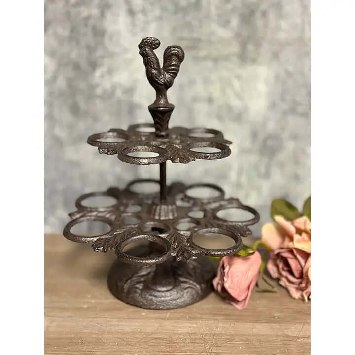 Rustic farmhouse cast iron two-tier egg holder with rooster design, perfect for kitchen decor and egg storage.