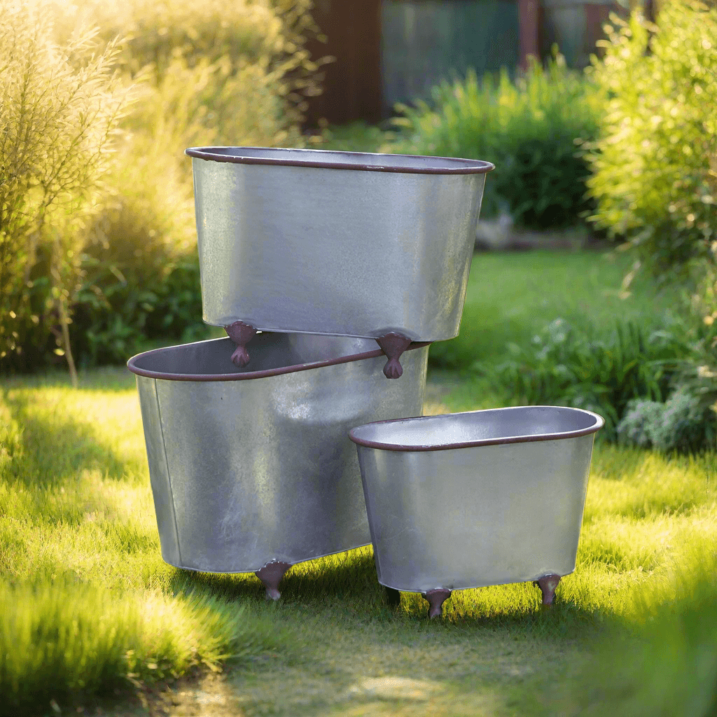 Rustic galvanized metal clawfoot planters set of 3 in a garden setting, showcasing vintage style and durability.