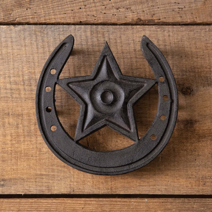 Rustic Western Star Cast Iron Trivet with horseshoe design on wooden background, ideal for farmhouse decor.