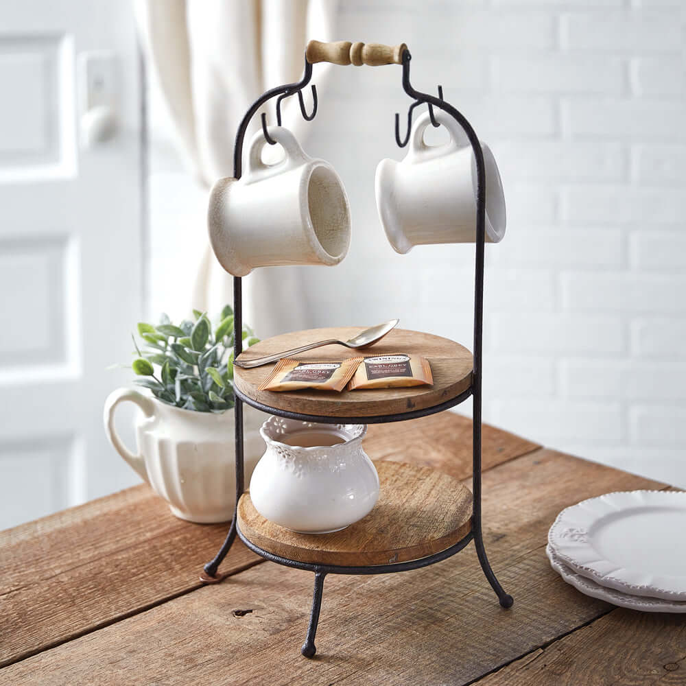 Two-tier wooden serving stand with hooks, showcasing mugs and decor, perfect for dining or coffee station display.