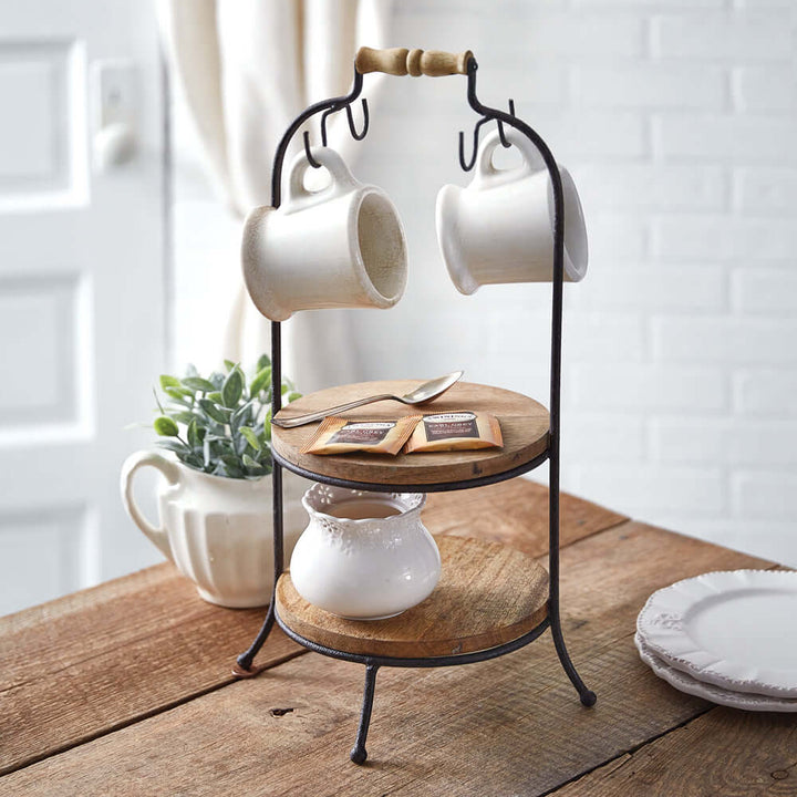 Two-tier wooden serving stand with hooks, showcasing mugs and decor, perfect for dining or coffee station display.