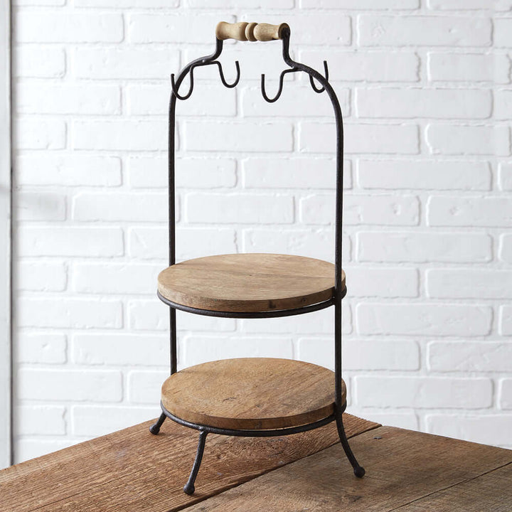 Two-tier wooden serving stand with hooks, featuring durable metal and natural wood for rustic charm and functionality.