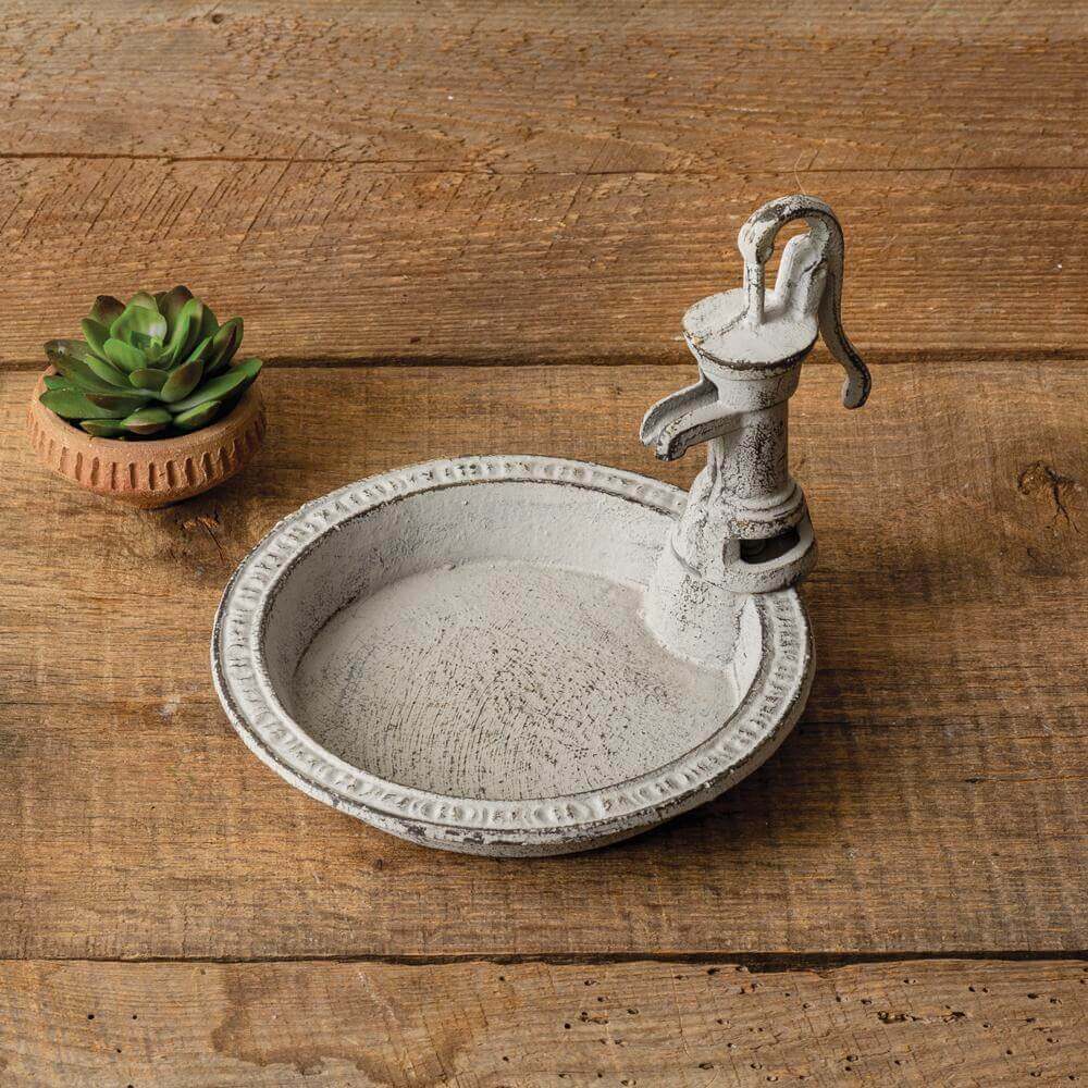 Vintage farmhouse soap dish shaped like a water pump, perfect for bathroom or kitchen decor, made of cast iron.